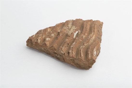 Roman Tile from Chatley Farm bath house. The unique marks from the die can be clearly seen as wavey lines across the surface.