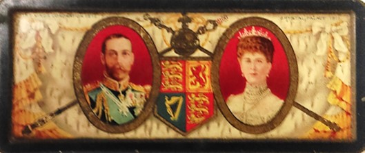 Rowntree sweet tin for the coronation fete of King George V at Crystal Palace in 1911. The lid has a picture of King George V and Queen Mary, with the Royal Standard, sceptre and orb in the middle.