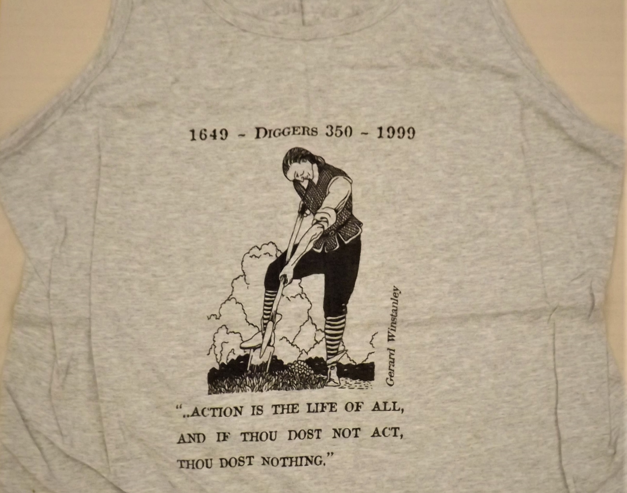 The front of a vest from The Land is Ours Campaign with Gerrard Winstanley quote 'Action is the life of all, and if thou dost not act, thou dost nothing'.