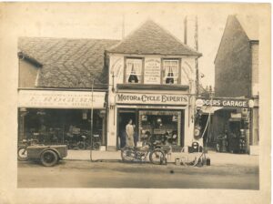 Rogers & Sons store in Weybridge High Street as an early garage & motor shop before they expanded to electrical goods, c.1920s. This is now the site of Waitrose.